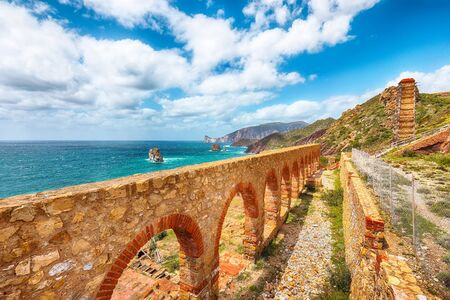 Splendid spring view of ancient ruins of Laveria Lamarmora (Miniera di Nebida). Stunning Mediterranean seascape.  Location:  Nebida, Sardinia, Italy Europeの写真素材