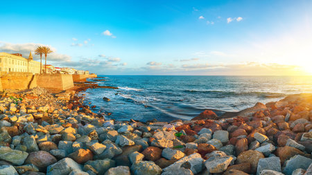 Gorgeous evening cityscape of historical part of Alghero town. Fantastic  Mediterranean seascape....