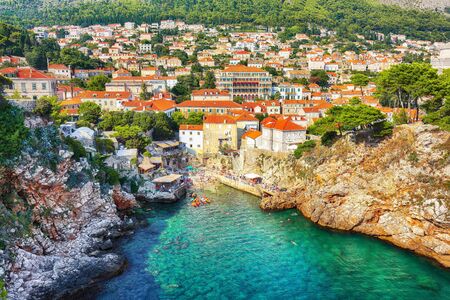Aerial view at famous travel destination city of Dubrovnik -  Suluci beach and old  city on a sunny day. Location:  Dubrovnik, Dalmatia, Croatia, Europeの写真素材