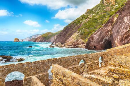 Fantastic spring view of ancient ruins of Laveria Lamarmora (Miniera di Nebida) and Nebida coast. Stunning Mediterranean seascape.  Location:  Nebida, Sardinia, Italy Europeの写真素材