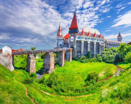 Beautiful panorama of the Hunyad Castle / Corvin's Castle with wooden bridge. Fantastic summer sunrise in Hunedoara, Transylvania, Romania, Europeのeditorial素材