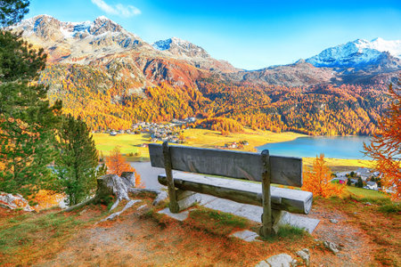 Awesome autumn panorama of Silvaplana lake and Surlej village. Location: Silvaplana, Maloya...