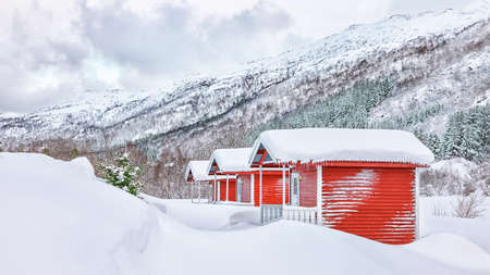Traditional Norwegian architecture and winter scenery with red wooden houses on Lofoten Islands near Stamsund. Location: Stamsund, Lofoten islands, Norway, Europe.の写真素材