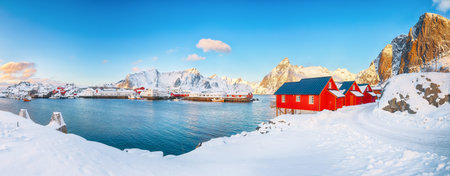 Gorgeous winter view on Hamnoy village with port and Festhaeltinden and Olstinden peaks on...
