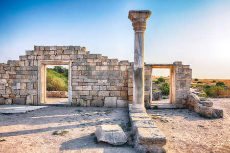 Fantastic sunset over ruins of the Basilica in ancient city Chersonese - national historical and archaeological reserve. Sevastopol. Crimeaの写真素材