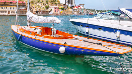 View of Balaklava bay with yachts on embankment of Balaklava in Sevastopol city. Yachts and boats...