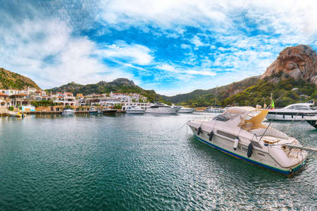 Awesome view of Poltu Quatu port and bay with yachts and motorboats. Popular travel destination of Mediterranean sea. Location: Poltu Quatu, Province of Sassari, Sardinia, Italy, Europeの写真素材