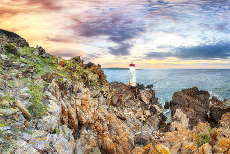Fabulous view of sunset over Capo Ferro Lighthouse. Popular travel destination of Mediterranean sea. Location: Porto Cervo, Province of Sassari, Sardinia, Italy, Europeの写真素材