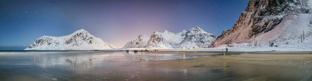 Fabulous winter scenery on Skagsanden beach at night with starry sky. Popular tourist destination....