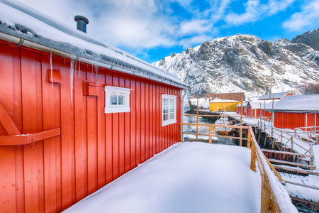 Amazing morning seascape of Norwegian sea and cityscape of Nusfjord village. Popular travel destination on Lofotens. Location: Nusfjord, Flakstad Municipality, Lofoten; Norway, Europeの写真素材