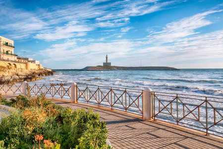 Stunning view on Lighthouse of Vieste, rising on the isle of Santa Eufemia. Lighthouse In Vieste, Gargano Peninsula, Apulia region, Italy, Europeの写真素材