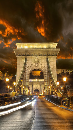 Amazing night scene with traffic on SzÃ©chenyi Chain bridge over Danube river. Location: Budapest city, Hungary, Europe.の写真素材