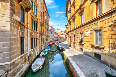 Fabulous cityscape of Venice with narrow canals, boats and gondolas and bridges with traditional buildings. Location: Venice, Veneto region, Italy, Europeの写真素材