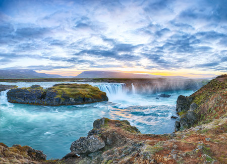 Breathtaking sunset scene of powerful Godafoss waterfall. Dramatic sky over Godafoss. Location: Bardardalur valley, Skjalfandafljot river, Iceland, Europeの写真素材