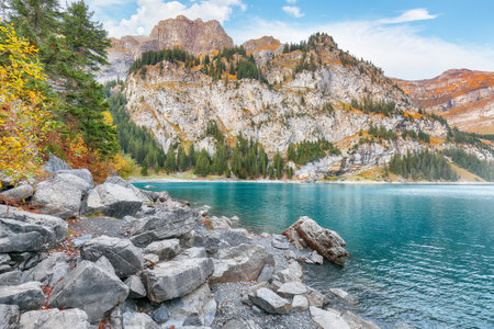 Fabulous autumn view of Oeschinensee Lake. Scene of Swiss Alps with Bluemlisalp summit on background. Location: Oeschinen valley, Canton of Bern, Switzerland, Europeの写真素材