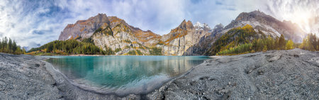 Spectacular autumn view of Oeschinensee Lake. Scene of Swiss Alps with Bluemlisalp summit on...