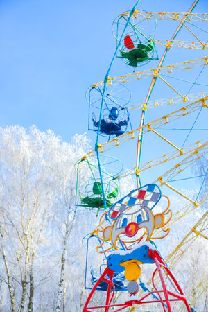 Amazing view of ferris wheel surrounded by snowcovered trees. Lots of snowの写真素材