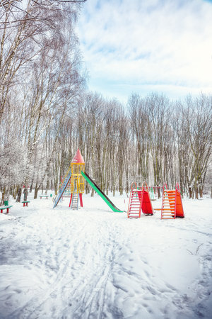 Amazing view of empty children playground in winter day.  Winter landscapeの写真素材