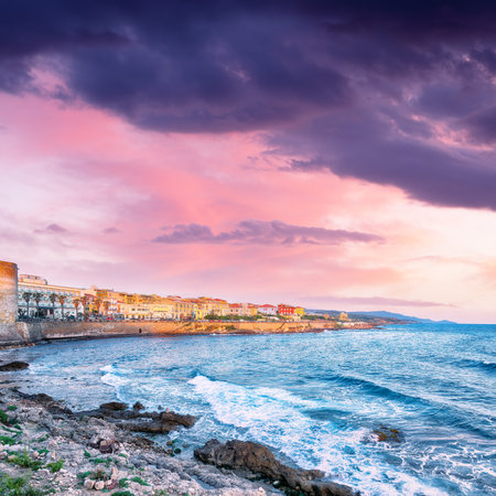 Amazing evening cityscape of historical part of Alghero town. Fantastic  Mediterranean seascape. Location:  Alghero, Province of Sassari, Italy, Europeの写真素材
