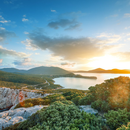 Unbelivable morning view on Cacccia cape. Panoramic view on the cliffs at sunrise. Fantastic Mediterranean seascape. Location:  Alghero, Province of Sassari, Italy, Europeの写真素材