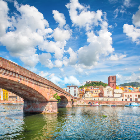 Attractive cityscape of Bosa town with Ponte Vecchio bridge across the Temo river. River embankment with colorful  houses. Location:  Bosa town, Province of Oristano, Italy, Europeの写真素材