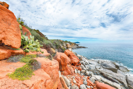Exciting  sunset view of Red Rocks (is Scoglius Arrubius) on Cea beach. Location: Tortoli, Province of Ogliastra, Sardinia, Italy, Europeの写真素材