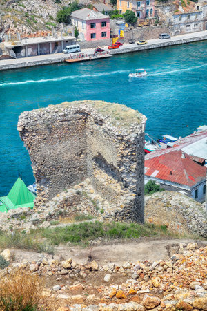 Amazing view of Balaklava bay with yachts and ruines of Genoese fortress Chembalo in Sevastopol city from the height. Crimeaの写真素材