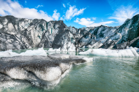 Impressive view on Solheimajokull glacier in Katla Geopark on Icelandic Atlantic South Coast. Location: South glacial tongue of Myrdalsjokull ice cap, near Vik village, Iceland, Europeの写真素材