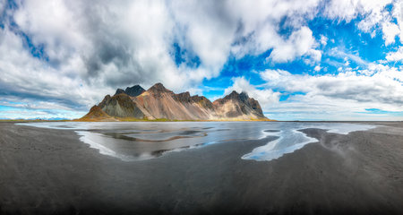 Impressive  sunny day and gorgeous reflection of Vestrahorn mountaine on Stokksnes cape in Iceland. Location: Stokksnes cape, Vestrahorn (Batman Mount), Iceland, Europe.の写真素材