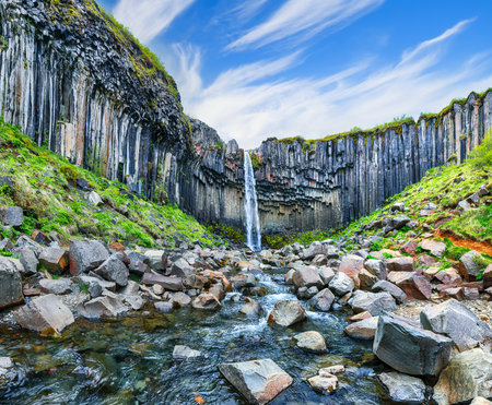 Ramarkable view of Svartifoss waterfall with basalt columns on southern part of Iceland.  Location:  Skaftafell National Park, Vatnajokull glacier, Iceland, Europe.の写真素材