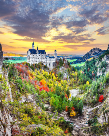 Amazing autumn view of famous Neuschwanstein Castle at sunset. Location: Hohenschwangau, Schwaben region, Bavaria state, Germany, Europeの写真素材