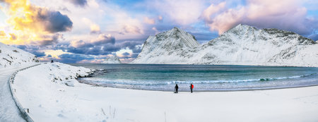 Amazing winter view of Vik and Haukland beaches during sunset with lots of snow  and snowy  mountain peaks near Leknes.  Location: Leknes, Vestvagoy, Lofotens, Norwayの写真素材