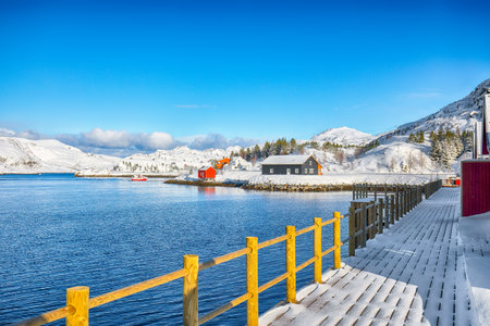 Amazing winter view of  fishing village on Sundstraumen strait that separates Moskenesoya and Flakstadoya islands. Location: Flakstadoya island, Lofoten; Norway, Europeの写真素材