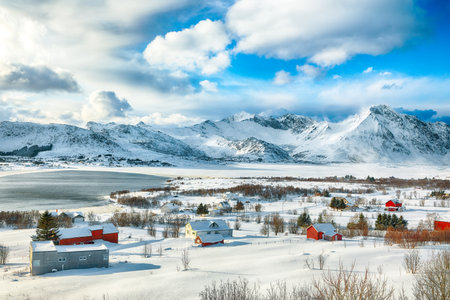 Amazing winter scenery over Bostad village and Torvdalshalsen lake seen from Torvdalshalsen. Location: Bostad, Vestvagoy, Lofotens, Norwayの写真素材