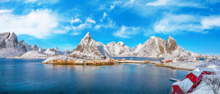 Amazing winter view of Sakrisoy village and snowy mountaines on background. Popular tourist destination on Lofotens.  Location: Sakrisoy , Moskenesoya , Lofoten; Norway, Europeの写真素材