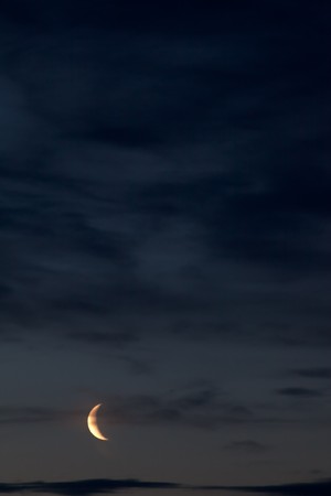 Night sky with moon and some cloudsの写真素材