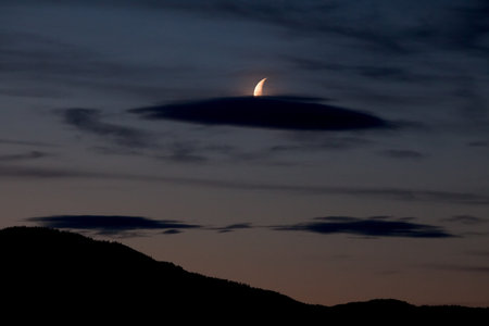 Night sky with moon and some cloudsの写真素材