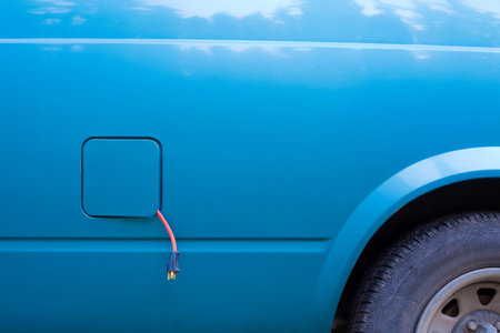 Plug-in electric car being charged.の写真素材