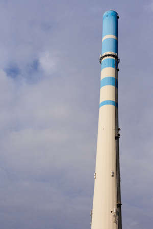 White-blue industrial high concrete chimney.の写真素材