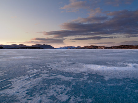 Vast ice surface of huge frozen Lake Laberge,  Yukon Territory, Canada, in April