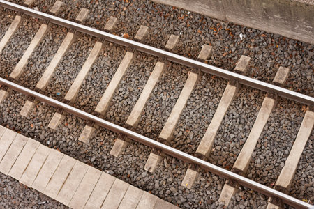 Railway track on  railroad embankment of gravel and concrete.の写真素材