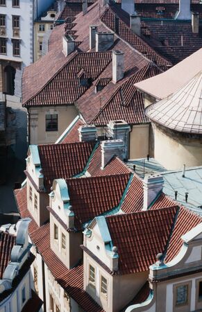 Overhead view looking down onto the tiled red rooftops of Prague, capital of Czechia, Europeの写真素材