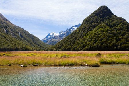 Snowy peaks and glacial valleys of Humboldt Mountains vista from Routeburn Track hiking trail, Southern Alps, New Zealandの写真素材