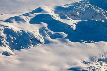 Snow covered mountain peaks perfect for heli-skiing in British Columbia, Canada.の写真素材