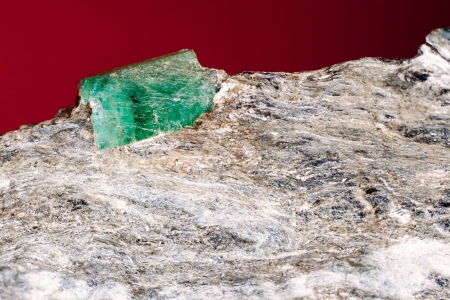 Rare emerald raw precious gemstone on matrix rock, an expensive variety of beryl  Birthstone for May and starstone associated with Taurus and Cancer の写真素材