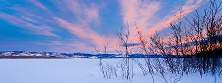 Beautiful winter wilderness landscape of frozen Lake Laberge  Yukon Territory  Canadaの写真素材