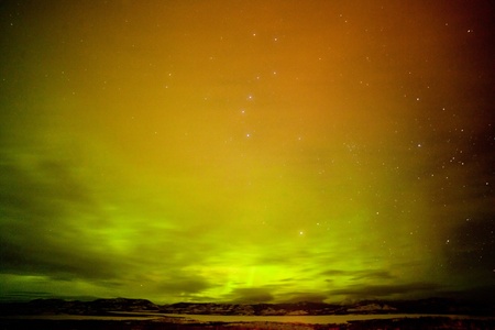 Surreal night sky of Northern Lights or Aurora borealis  thin clouds and stars over snowy winter landscape of Lake Laberge  Yukon Territory  Canadaの写真素材