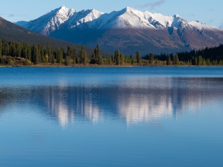 Snowcapped mountain reflection on calm surface of Lapie Lake  Yukon Territory  Canadaの写真素材