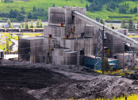 Detail of coal mine black dirty structure between piles of coal fossil energy fuel resource from active miningの写真素材