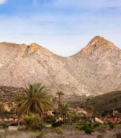 Small Finca farm house in maccia of dry mountain landscape in southern Spain, Region of Murciaの写真素材